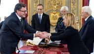Italy's new Economy Minister Giancarlo Giorgetti shakes hands with Italy's Prime Minister Giorgia Meloni during the swearing-in ceremony at the Quirinale Presidential Palace, in Rome, Italy, October 22, 2022. (Italian Presidency/Handout via REUTERS)