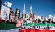 Protestors in support of women in Iran hold a banner reading 'Women Life Freedom' during a protest following the death of Mahsa Amini, in Ottawa, Ontario, Canada, on October 29, 2022. REUTERS/Spencer Colby/File Photo