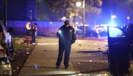 Police investigate the scene where as many as 14 people were reported to have been shot on October 31, 2022 in Chicago, Illinois. Scott Olson/Getty Images/AFP