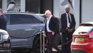 Former British Prime Minister Boris Johnson walks, at Gatwick Airport, near London, Britain October 22, 2022. REUTERS/Henry Nicholls