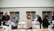 Members of the local electoral commission count votes at the polling station at Odense Town Hall, Denmark, on November 1, 2022. Ritzau Scanpix via REUTERS