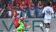 Viktoria Plzen's Czech forward Tomas Chory (top L) falls over Barcelona's Spanish goalkeeper Inaki Pena during the UEFA Champions League Group C football match FC Viktoria Plzen v FC Barcelona in Plzen, Czech Republic, on November 1, 2022.  Joe Klamar / AFP