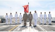 Qatari and Turkish officials on the deck of F-513 Burgazada at Umm Al Houl Naval Base.