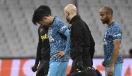 Tottenham's South Korean striker Son Heung-Min (2nd-L) leaves the pitch after sustaining an injury as Tottenham's Brazilian midfielder Lucas Moura (R) follows him during the UEFA Champions League group D football match between Olympique Marseille (OM) and Tottenham Hotspur at The Velodrome Stadium in Marseille, southern France on November 1, 2022. (Photo by Christophe SIMON / AFP)