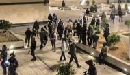This image grab from a UGC video posted on November 1, 2022, reportedly shows Iranian security forces warning residents in a complex in the Chitgar district of the capital Tehran. (Photo by UGC / AFP)