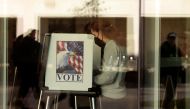 People cast their early ballots for the 2022 general election at the Ann Arbor, Michigan city clerk's satellite office on the campus of the University of Michigan, on the eve of the US midterm elections, on November 7, 2022. (Photo by JEFF KOWALSKY / AFP)