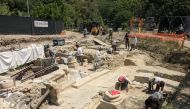 People work at the site where 2,300-year-old bronze statues have been discovered, in San Casciano dei Bagni, Italy, in this handout photo obtained by Reuters on November 8, 2022. Ministero della Cultura/Handout via REUTERS