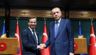 Turkish President Tayyip Erdogan and Swedish Prime Minister Ulf Kristersson shake hands after a news conference at the Presidential Palace in Ankara, Turkey, November 8, 2022. (Murat Cetinmuhurdar/Handout via REUTERS)