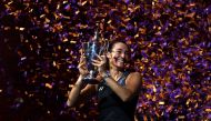 Caroline Garcia of France celebrates with the Billie Jean King Trophy after defeating Aryna Sabalenka of Belarus in their Women's Singles Final match during the 2022 WTA Finals, part of the Hologic WTA Tour, at Dickies Arena on November 07, 2022 in Fort Worth, Texas. Katelyn Mulcahy/Getty Images/AFP