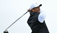 In this file photo taken on July 15, 2022, US golfer Tiger Woods watches his drive from the second tee during his second round on the day two of The 150th British Open Golf Championship on The Old Course at St Andrews in Scotland. (AFP/Glyn Kirk)