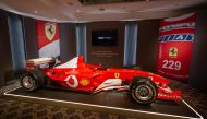 This file photo taken on November 4, 2022 shows F1 World Champion Michael Schumacher's Formula One Ferrari F2003 GA with chassis number 229 during Sotheby's auction house preview in Geneva. (Photo by Fabrice COFFRINI / AFP)