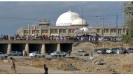 This image grab from a UGC video posted on November 11, 2022, shows protesters marching in Khash, in Iran's southeastern province of Sistan-Baluchistan. (Photo by UGC / AFP)