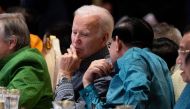 US President Joe Biden (left) and Cambodia's Prime Minister Hun Sen speak as they attend the East Asia Summit Gala dinner in Phnom Penh, on November 12, 2022. (Photo by SAUL LOEB / AFP)