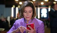 US House Speaker Nancy Pelosi looks at her phone, as she attends the COP27 climate summit, in Sharm el-Sheikh, Egypt, on November 11, 2022. REUTERS/Kevin Lamarque 
