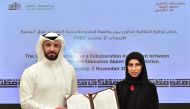 QU’s Vice-President for Student Affairs Dr. Eiman Mustafawi and EAA Programme Director Talal Al Hothal during the signing of the MoU.