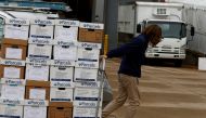A person transports boxes with documents for the trial of Elon Musk, Chief Executive Officer (CEO) of SpaceX, Tesla and Twitter, regarding his Tesla pay package at the Delaware Court of Chancery in Wilmington, Delaware, U.S., November 16, 2022. REUTERS/Evelyn Hockstein