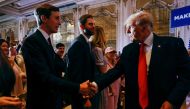 Former US President Donald Trump shakes hands with his son-in-law Jared Kushner in front of his son Eric after Trump announced that he will once again run for US president in the 2024 US presidential election during an event at his Mar-a-Lago estate in Palm Beach, Florida, US November 15, 2022. REUTERS/Jonathan Ernst