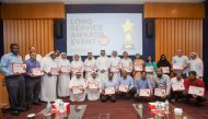 Ooredoo employees with other officials at the award ceremony.