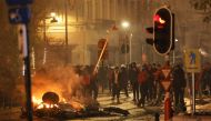 General view of people clashing with the police in Brussels, after the World Cup match between Belgium and Morocco on Sunday. (REUTERS/Yves Herman)
