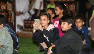 Children attend an event at Darb Al Saai.