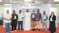 Sheikh Nasser bin Hamad bin Nasser Al Thani, Chief Commercial Officer, Ooredoo Qatar with winners during a prize distribution ceremony.