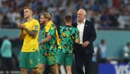 December 3, 2022 Australia coach Graham Arnold with Cameron Devlin, Jason Cummings and Riley McGree after the match as Australia are eliminated from the World Cup REUTERS/Molly Darlington