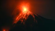 Fuego volcano, as seen from Alotenango, a municipality in Sacatepequez department 65 kilometres southwest of Guatemala City, erupts on December 11, 2022. (Photo by Johan ORDONEZ / AFP)