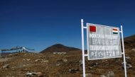 A signboard is seen from the Indian side of the Indo-China border at Bumla, in the northeastern Indian state of Arunachal Pradesh, November 11, 2009. Picture taken November 11, 2009. File Photo / Reuters
