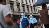 File photo: People wearing face masks walk along a street in Mexico City on June 4, 2021. (REUTERS/Edgard Garrido)