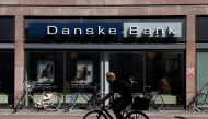 A person rides a bicycle past a Danske Bank branch in Copenhagen, Denmark, July 29, 2022. File Photo / Reuters
