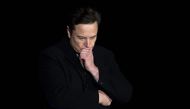 In this file photo taken on February 10, 2022 Elon Musk pauses and looks down as he speaks during a press conference at SpaceX's Starbase facility near Boca Chica Village in South Texas. - A Twitter account that tracked flights of Elon Musk's private jet was grounded on December 14, 2022 despite the billionaire's talk of free speech. (Photo by JIM WATSON / AFP)