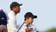 Tiger Woods and Charlie Woods of the United States during the pro-am prior to the PNC Championship at Ritz-Carlton Golf Club in Orlando, Florida, on December 16, 2022. (Mike Ehrmann/Getty Images/AFP)