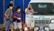 Family members of a Batang Kali, landslide victim, leave Sungai Buloh Hospital's mortuary in Sungai Buloh, Selangor, Malaysia, December 17, 2022. Reuters/Hasnoor Hussain