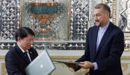Iranian Foreign Minister Hossein Amir-Abdoulahian and his Nicaraguan counterpart Denis Ronaldo Moncada Colindres (L) pose for a picture after signing a bilateral agreement at the offices of the foreign ministry in Tehran on December 18, 2022. (Photo by AFP)