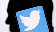 Twitter logo and Elon Musk silhouette are seen in this illustration taken on December 19, 2022. REUTERS/Dado Ruvic/Illustration/File Photo