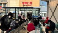 People wait outside a fever clinic at a hospital as coronavirus disease (COVID-19) outbreak continues, in Shanghai, China December 24, 2022. REUTERS/Staff/File Photo