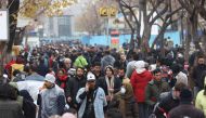 Iranians walk through Tehran Bazaar, in Tehran, on December 25, 2022. Majid Asgaripour/WANA (West Asia News Agency) via REUTERS