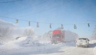 Vehicles are left stranded on the road following a winter storm that hit the Buffalo region on Main St. in Amherst, New York, US, December 25, 2022. REUTERS/Brendan McDermid
