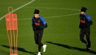 Paris Saint-Germain's Kylian Mbappe (left) and Neymar take part in a training session at the club's 