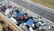 This aerial photo taken on December 28, 2022 shows a multi-vehicle collision on Zhengxin Yellow River Bridge in Zhengzhou, in China's central Henan province. (Photo by AFP) / China OUT
 