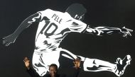 In this file photo taken on June 25, 2008 Brazilian soccer legend Edson Arantes do Nacimento, known as Pele, raises his arms during the opening ceremony of the 