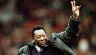 Brazilian soccer legend Pele greets the crowd at the Manchester United versus Liverpool match during the half time interval in Manchester, Britain, April 10, 1998. REUTERS/Ian Hodgson//File Photo

