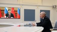 Russian President Vladimir Putin holds a meeting with Chinese President Xi Jinping via a video link at the Kremlin in Moscow on December 30, 2022. (Photo by Mikhail Klimentyev / SPUTNIK / AFP)