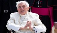 File photo: Pope Emeritus Benedict XVI gestures at the Munich Airport before his departure to Rome, June 22, 2020. Sven Hoppe/Pool via Reuters/File Photo