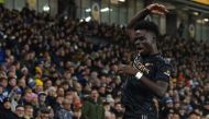 Arsenal's English midfielder Bukayo Saka celebrates after scoring the opening goal of the English Premier League match between Brighton and Hove Albion and Arsenal at the American Express Community Stadium in Brighton, southern England on December 31, 2022. (Photo by Glyn KIRK / AFP)