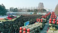 This picture taken on December 31, 2022 and released from North Korea's official Korean Central News Agency (KCNA) on January 1, 2023 shows a ceremony of donating 600mm Super-large Multiple Launch Rocket System in the yard of the headquarters of the Centr