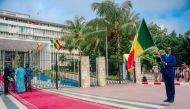 A man holds a Senegalese flag outside the Parliament in Dakar on September 12, 2022.  File Photo / AFP