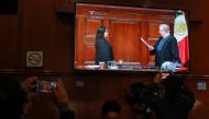 A screen shows the ceremony in which Norma Lucia Pina prepares to take the oath as president of the Supreme Court of Justice, in the press room of the Supreme Court building in Mexico City, Mexico, January 2, 2023. (REUTERS/Henry Romero)