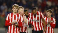 Brentford's Mads Roerslev, Ben Mee, Rico Henry and Ethan Pinnock celebrate after winning the Premier League match against Liverpool at Brentford Community Stadium, London, Britain, January 2, 2023. (Action Images via Reuters/John Sibley)