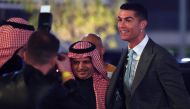 Portuguese forward Cristiano Ronaldo (right) greets President of Al-Nassr Musalli Al-Muammar upon his arrival at the Mrsool Park Stadium in the Saudi capital Riyadh on January 3, 2023, ahead of the unveiling ceremony. (Photo by Fayez Nureldine / AFP)